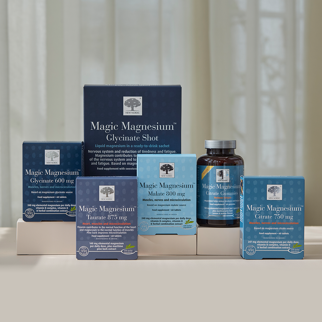 Range of Magic Magnesium™ products displayed in blue packaging on a neutral background.