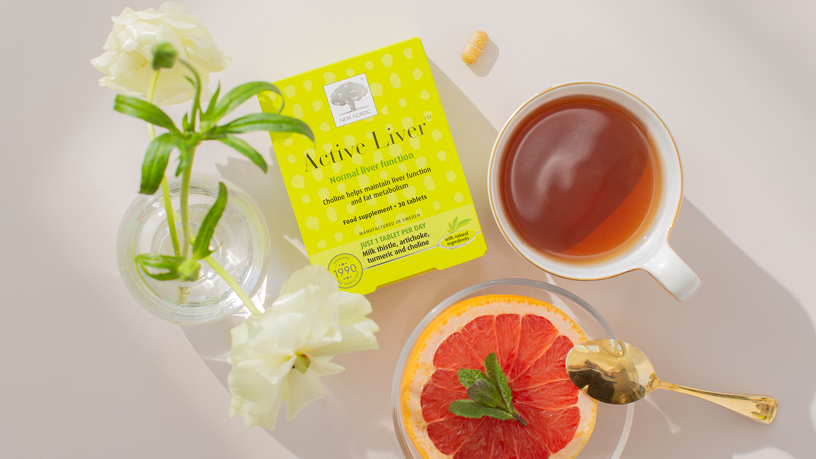 Wonder Legs⢠16 New Nordic Active Liver⢠package displayed alongside some tablet ingredients on a light background