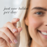 Woman holding a single tablet with text Just one tablet per day.