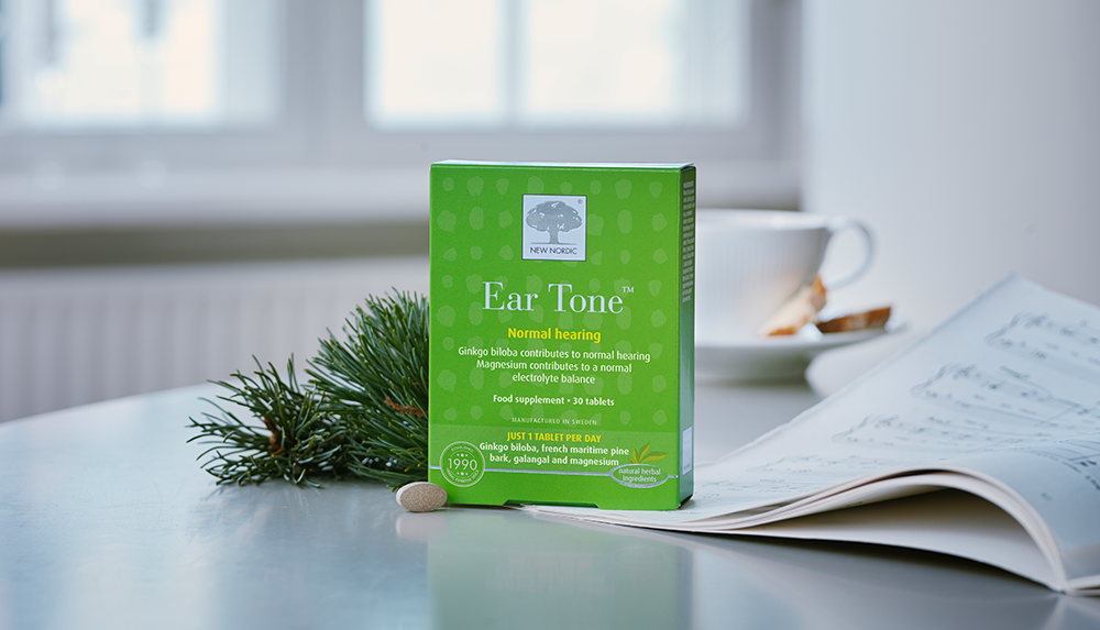 a box of ear supplement on a table