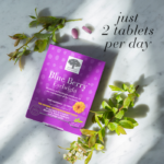 The purple Blue Berry™ Eyebright package displayed with blueberry branches and text just 2 tablets per day.