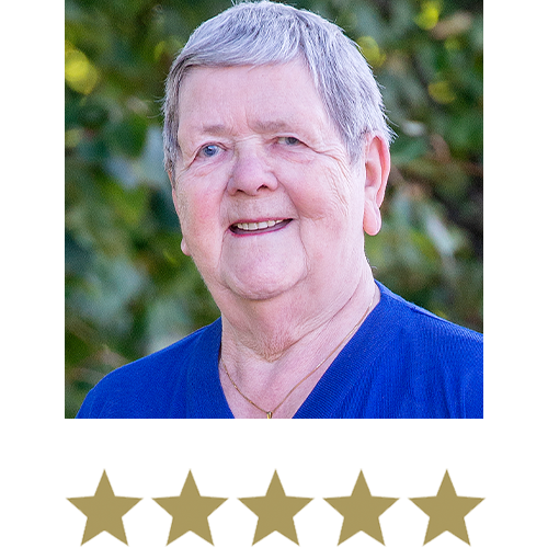 Fat Burner™ 11 Older Woman smiling in nature with five stars beneath