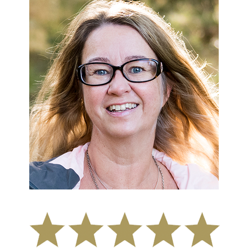 Fat Burner™ 9 Middle-Aged Woman wearing glasses smiling with five stars beneath