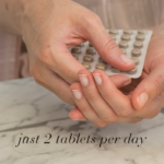 Woman taking Clear Brain™ tablets from a blister pack with text Just 2 tablets per day.