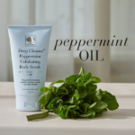 Deep Cleanse™ Peppermint exfoliating body scrub displayed with fresh mint and text Peppermint oil.