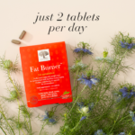 The Fat Burner™ package displayed with flowers, 2 tablets and text Just 2 tablets per day.