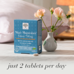 Magic Magnesium™ Citrate tablets displayed with light pink roses, a tablet and the text Jus 2 tablets per day.