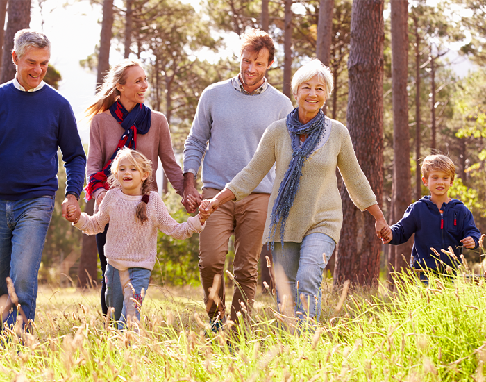 Family walking together in nature.
