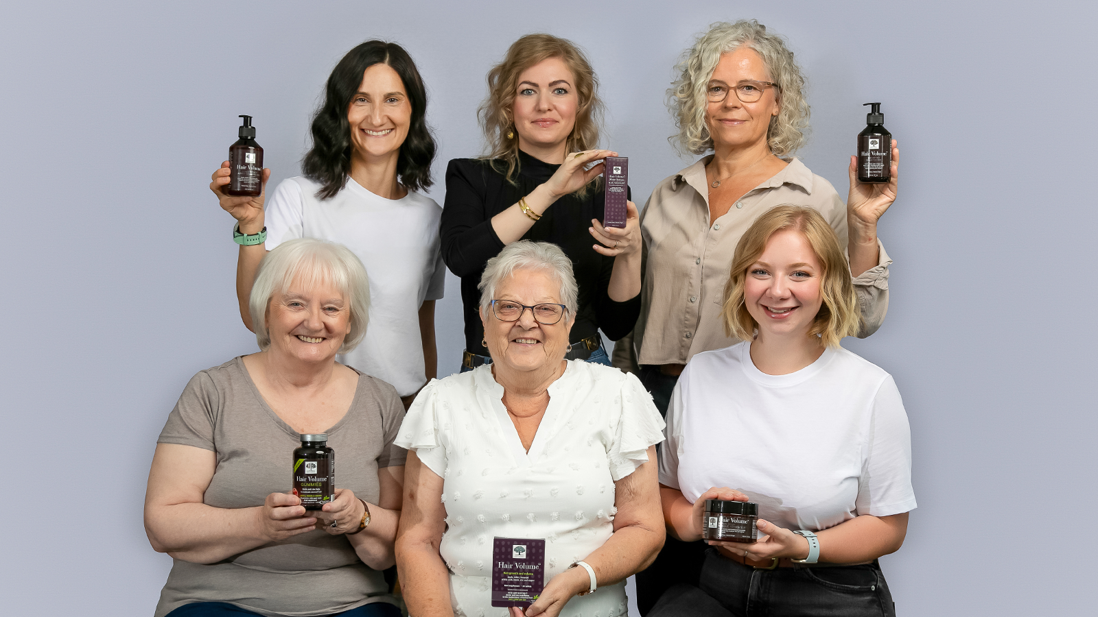 Home 26 Six women smiling and holding products from the New Nordic Hair Volume™ Series