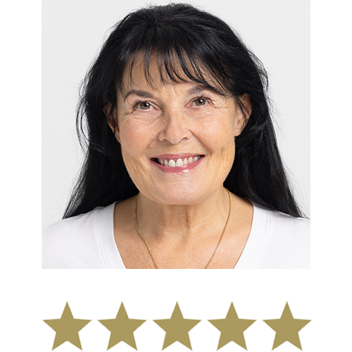 Natural Magic™ Anti-ageing Cream 12 Woman smiling with five stars displayed underneath.