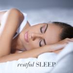 Woman sleeping peacefully in bed with text Restful sleep.