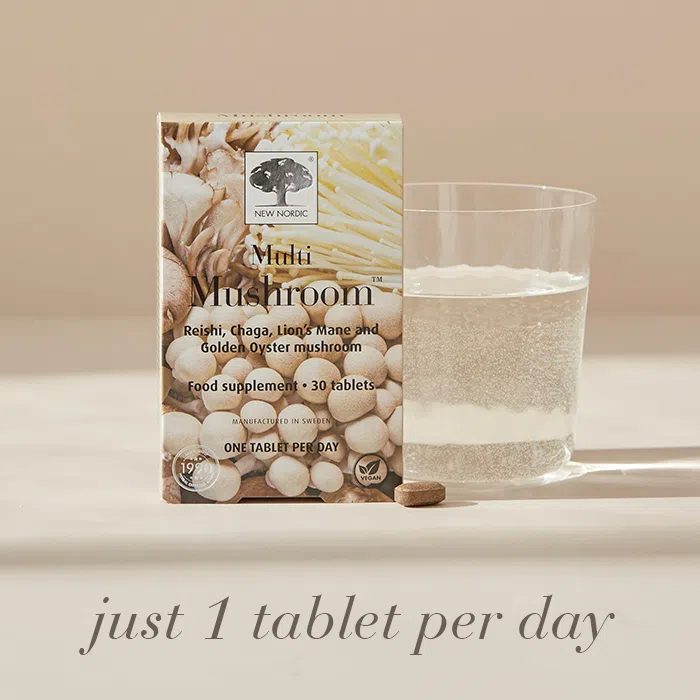 Multi Mushroom™ package displayed with a glass of water and the text Just 1 tablet per day.