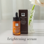 Pigment Clear™ Serum bottle shown with a flower and the text Brightening serum.