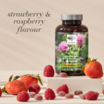Red Clover™ gummies package with strawberries and raspberries around.