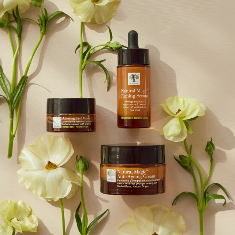 Natural Magic skin care range sourounded by flowers