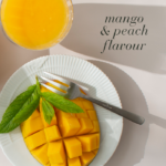 Fresh mango with mint garnish and text Mange and peach flavour