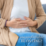 Image of woman holding her stomach with text Uncomfortable bloating?