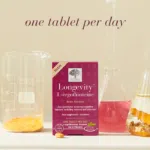 Longevity L-ergothioneine Supplement box with glass of water