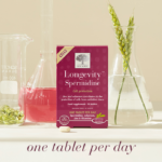 The Longevity™ Spermidine package with a tablet, a glass of water and the text One tablet per day.