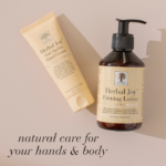Herbal Joy Anti-Ageing Hand Cream and Firming Lotion on beige background with text Natural care for your hands and body.