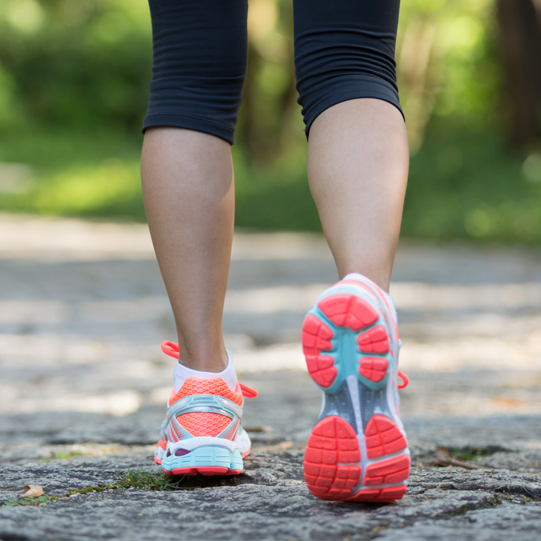 Image of legs, woman walking