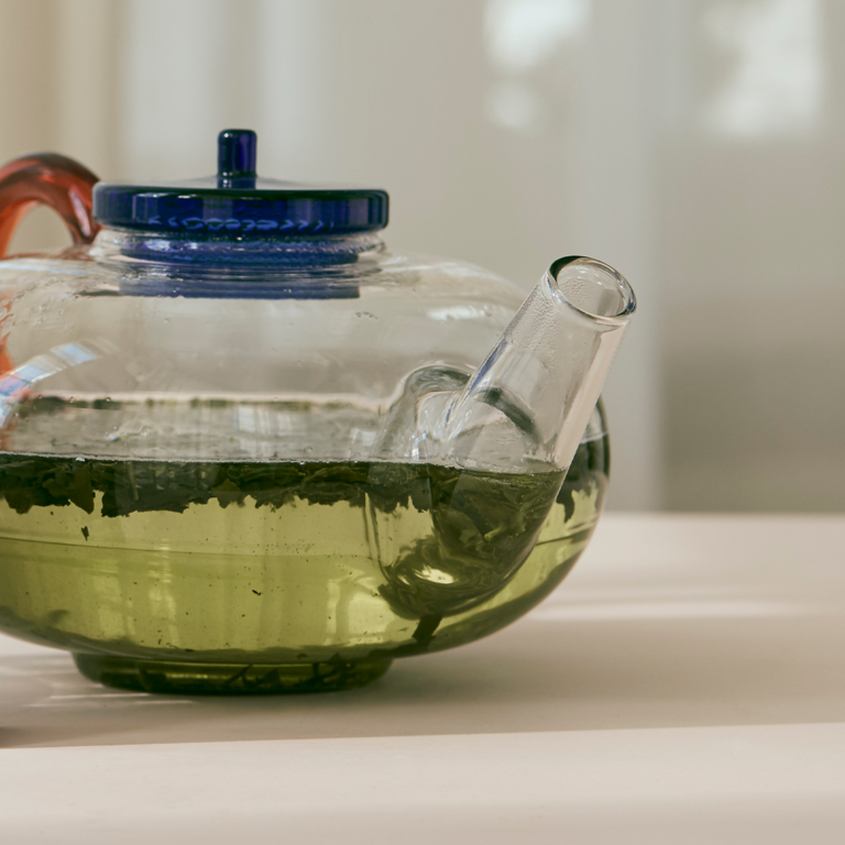 A clear pot of green tea