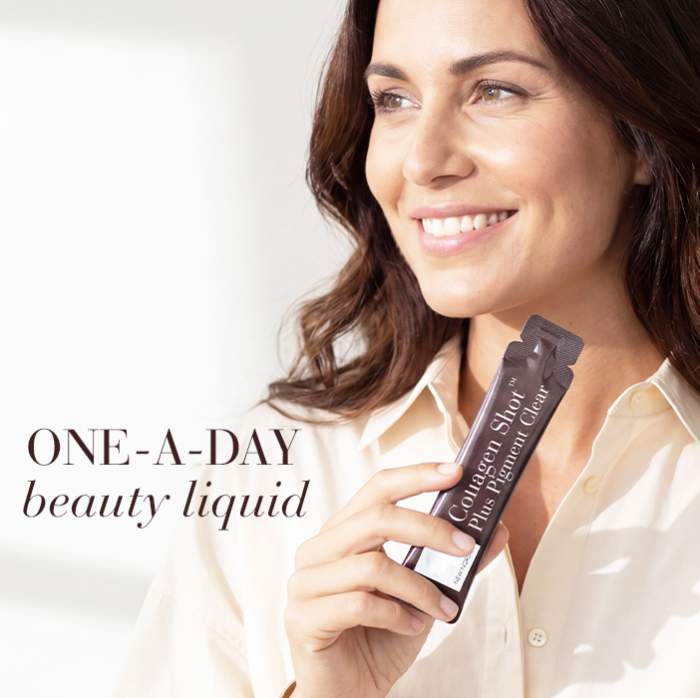 Woman holding sachet and smiling with the text one-a-day beauty liquid
