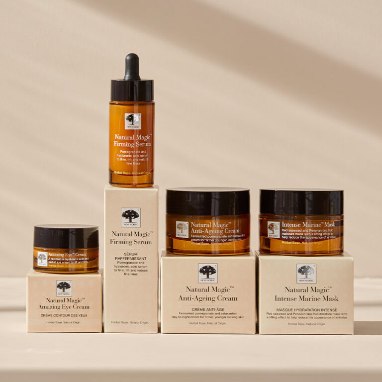 Four New Nordic Natural™ Magic skincare products lined up and sat on top of their boxes