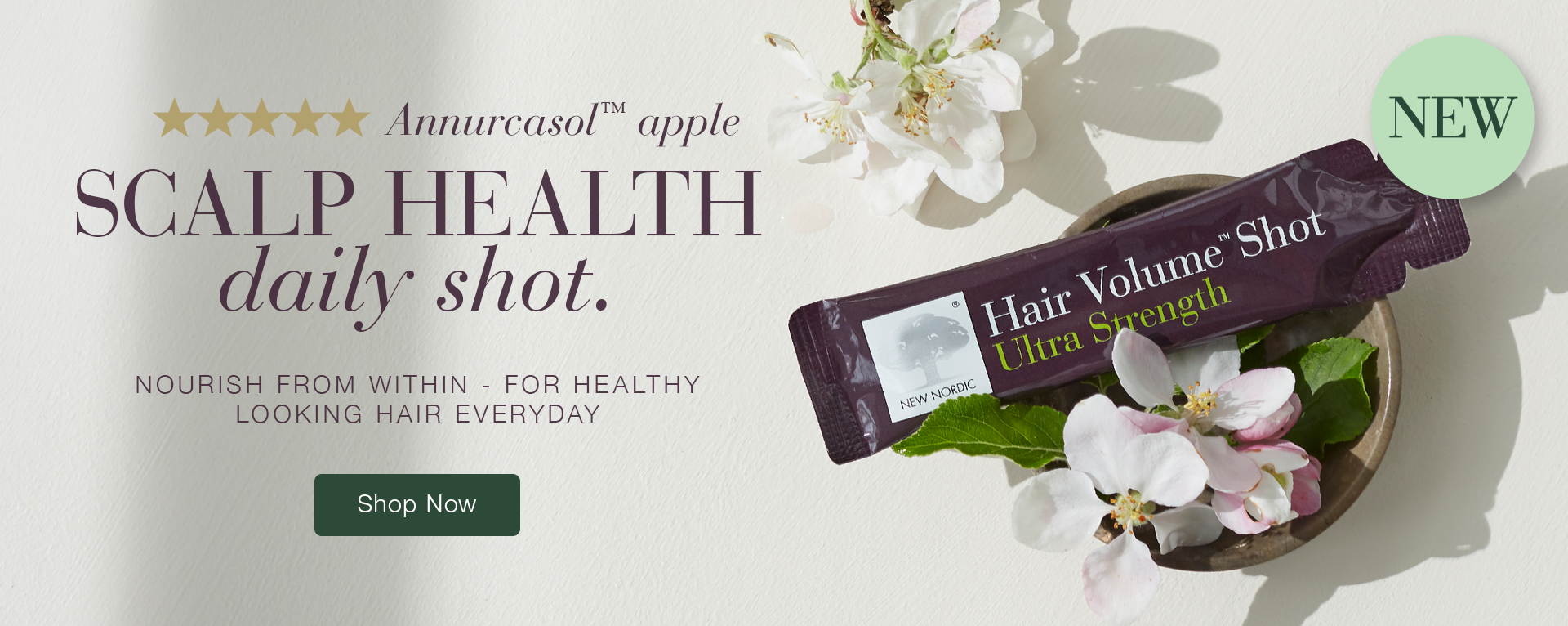 Hair Volume Shot Ultra Strength Sachet laying on some flowers with the text Annurcasol™ apple SCALP HEALTH daily shot. NOURISH FROM WITHIN - FOR HEALTHY-LOOKING HAIR EVERY DAY next to it