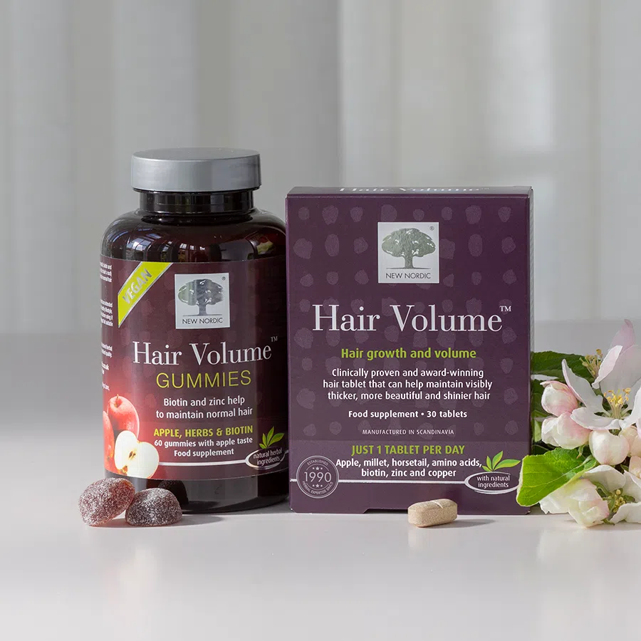 Packs of Hair Volume tablets and gummies
