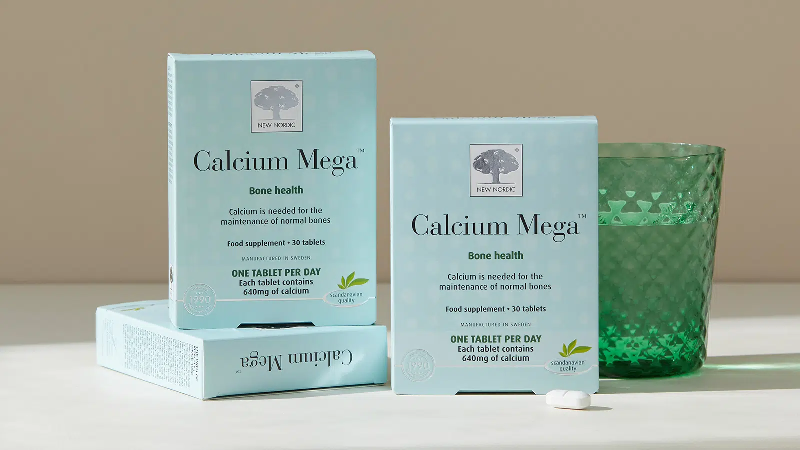 Calcium Mega™ 17 Calcium supplement box with green glass of water