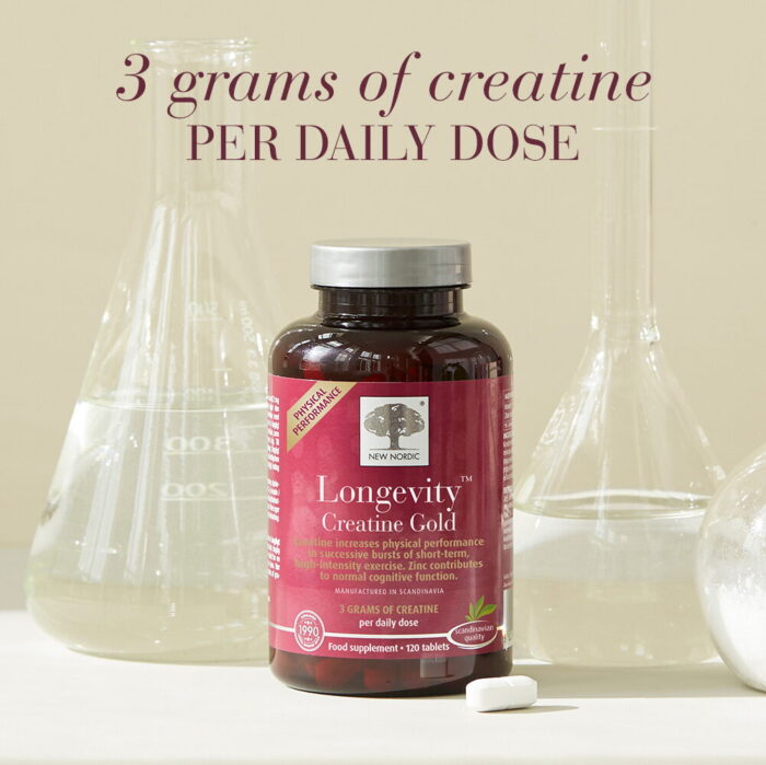 New Nordic Longevity™ Creatine Gold with laboratory glassware, providing 3 grams of creatine per daily dose.