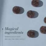 Magnesium glycinate gummies with maritime pine bark extract displayed on a light blue background.